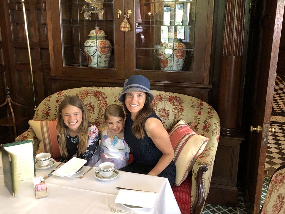 Mom and her two kids enjoy a tea time in Milestone Hotel in London.