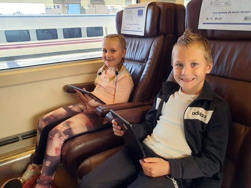 Little boy and girl in a train in Barcelona.