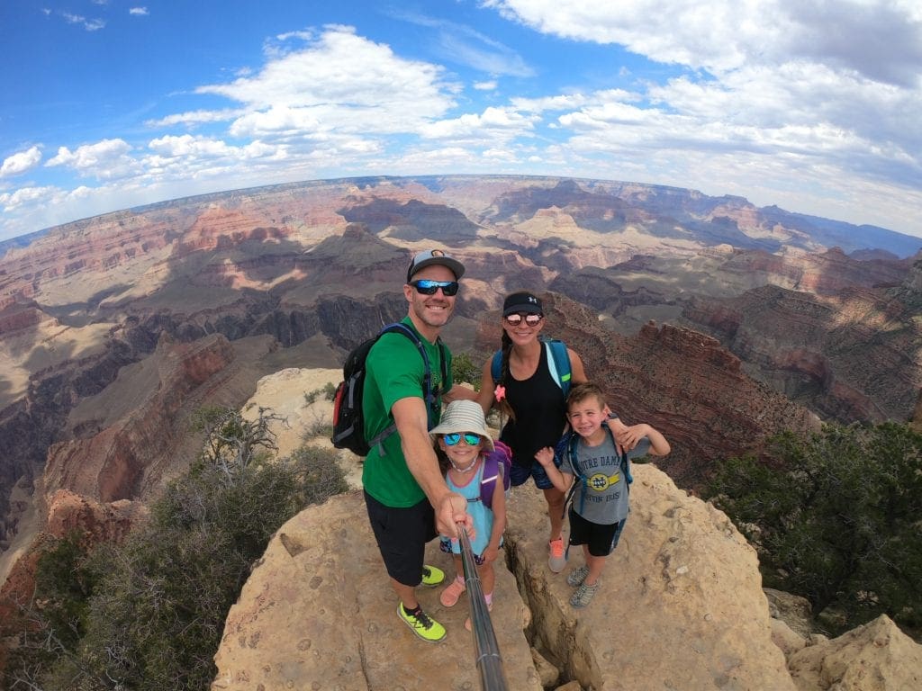 A family with a selfie stick in the Grand Canyon. 