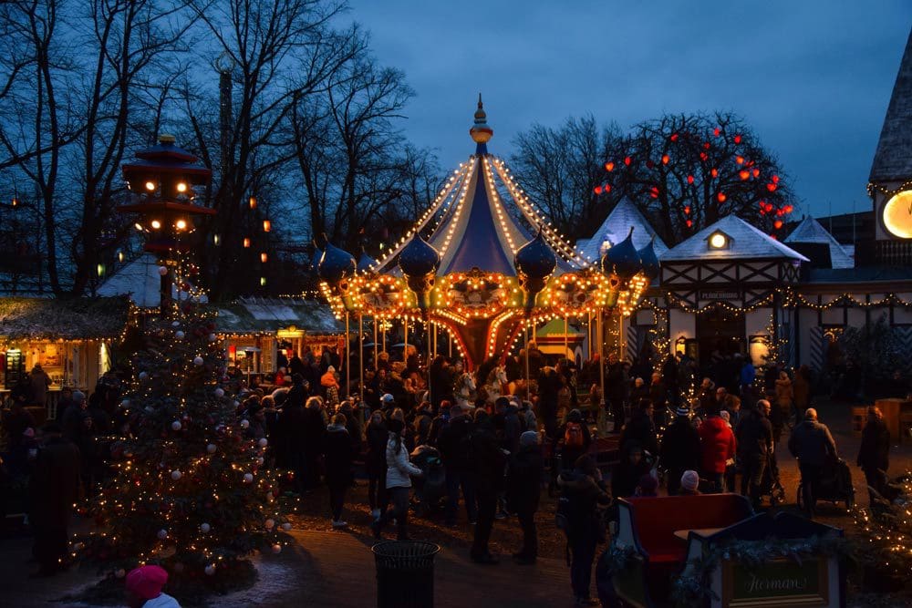 The carousel at the Tivoli Christmas Market lit up for Christmas at night.