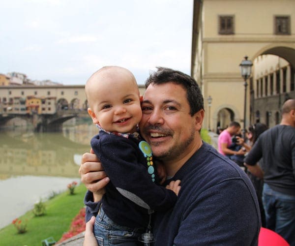 Father holding his baby in Florence Vacation Kidsi