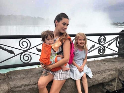 Mom with daughter in front of Niagara Falls.