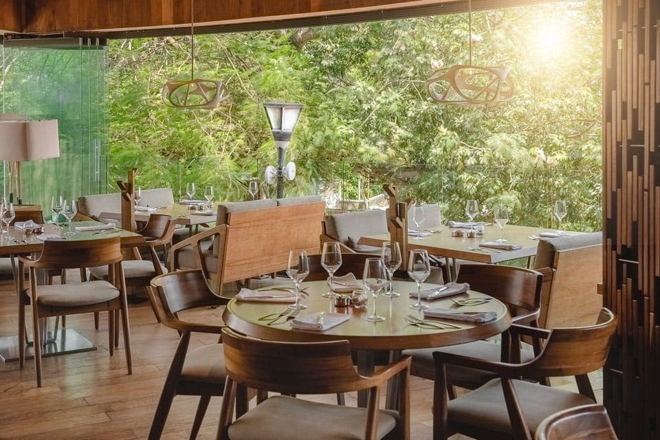 Inside Harry’s Steakhouse & Raw Bar, featuring a classic dining area with large windows.