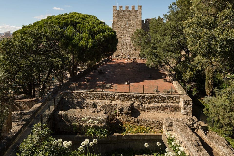 A view of St. George Castle through the trees.