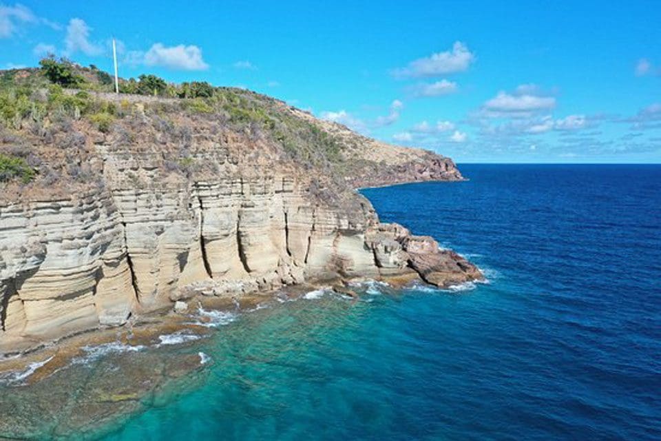 The shoreline of the Pillar of Hercules, one of the best things to do in Antigua with kids.