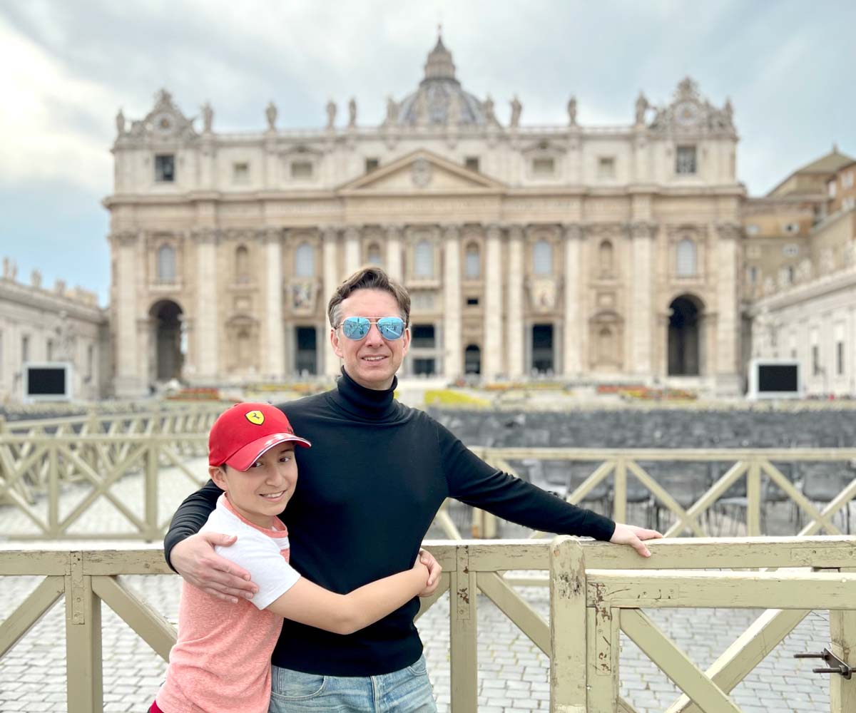 Father and son in front of Vatican in Rome Italy
