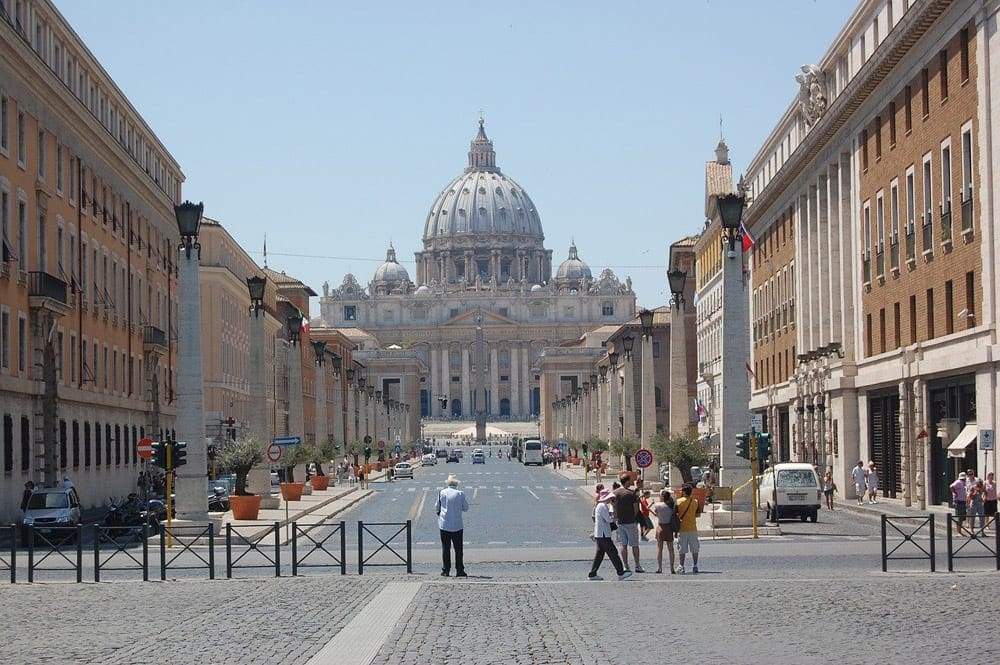 The Vatican in Rome surrounded by pedestrians. It's one of the best places to visit on an Italy itinerary with kids. 