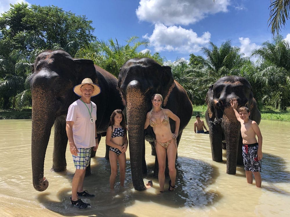 Lisa's family of four with three Asian elephants. 