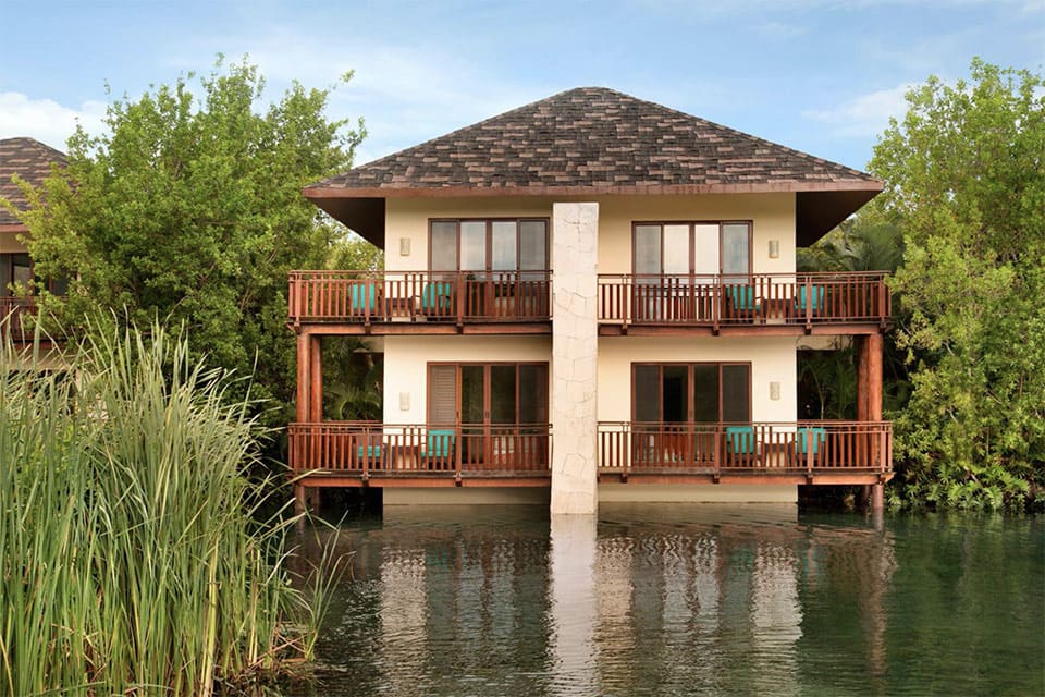 Villa at the Fairmont Mayakoba, one of the best resorts in Mexico for families, nestled along the water and among lush trees.