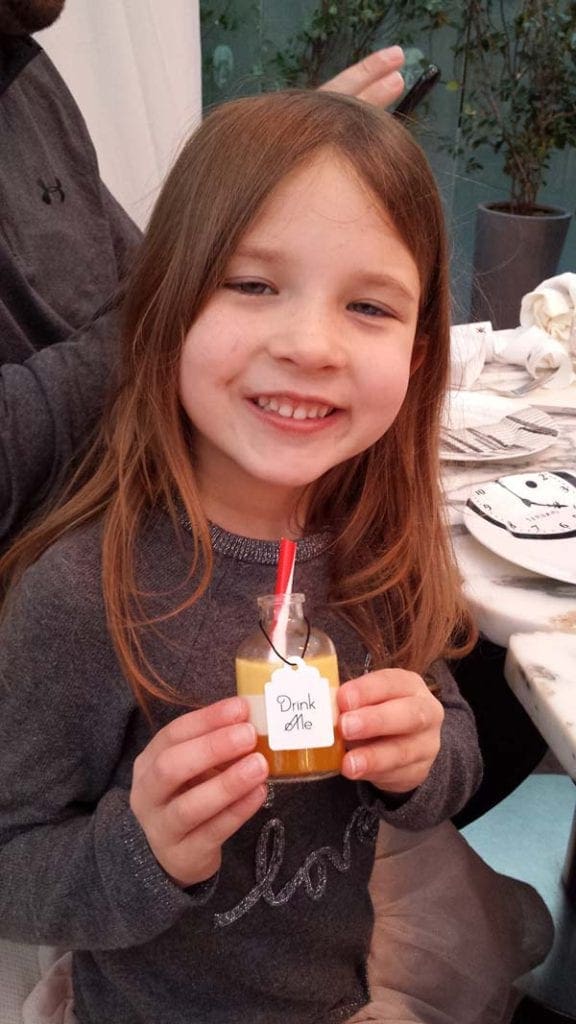 A young girl enjoys tea time at the Sanderson Hotel in London.