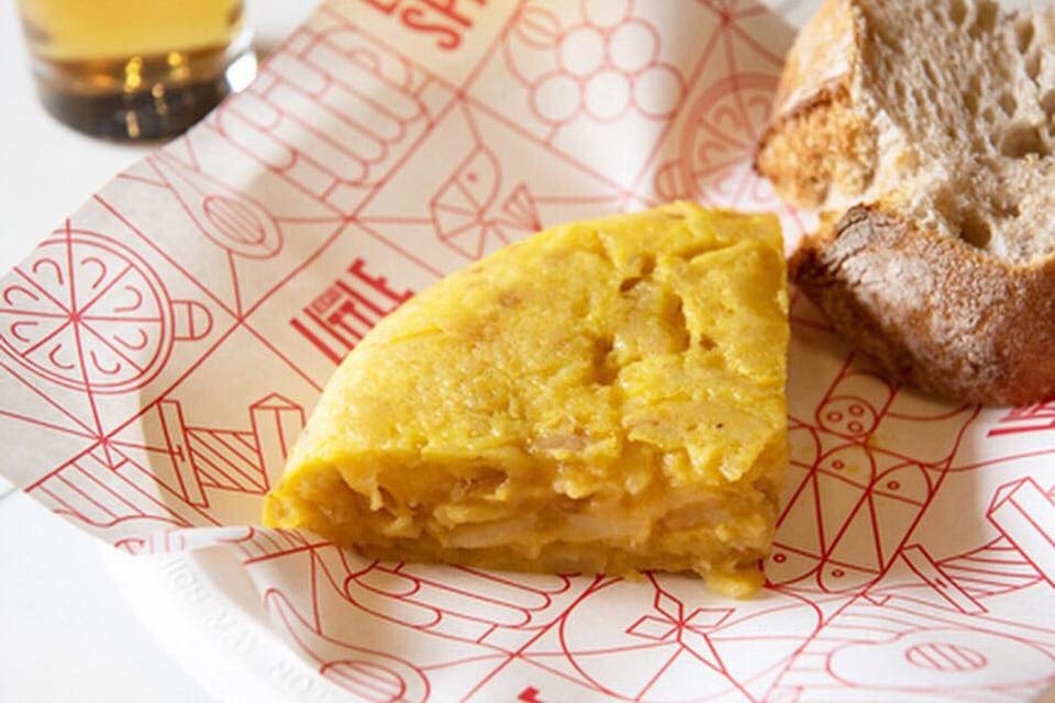 Picture of a tortilla and some bread at Mercado Little Spain in Hudson Yards, Manhattan