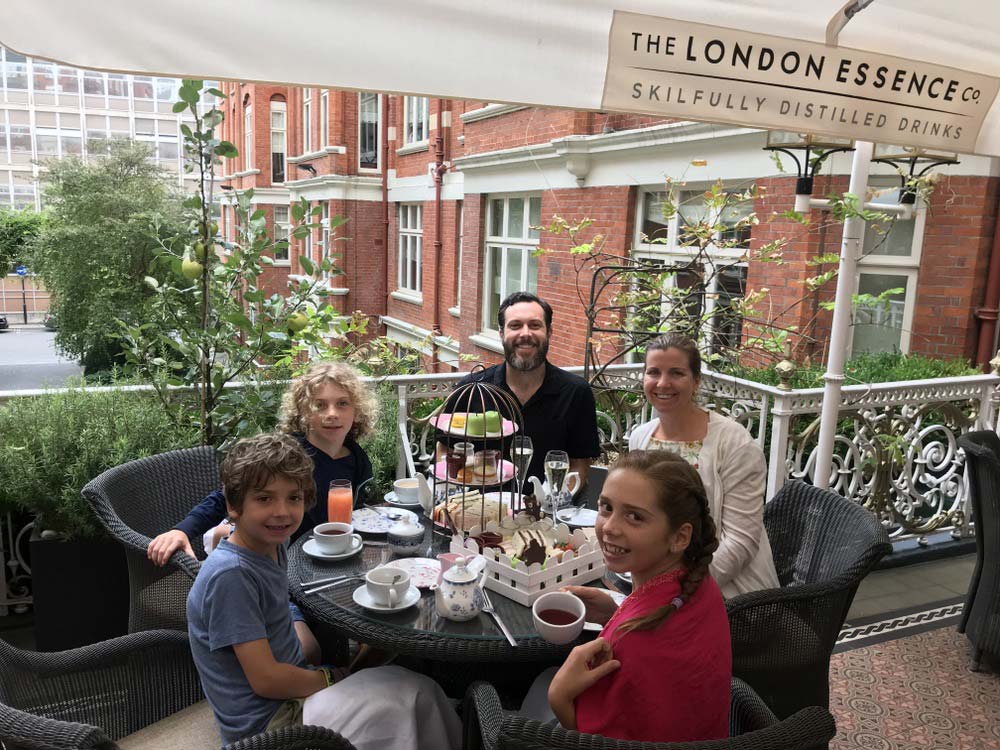 A family of five enjoys afternoon tea at the St. Ermin's Hotel London.