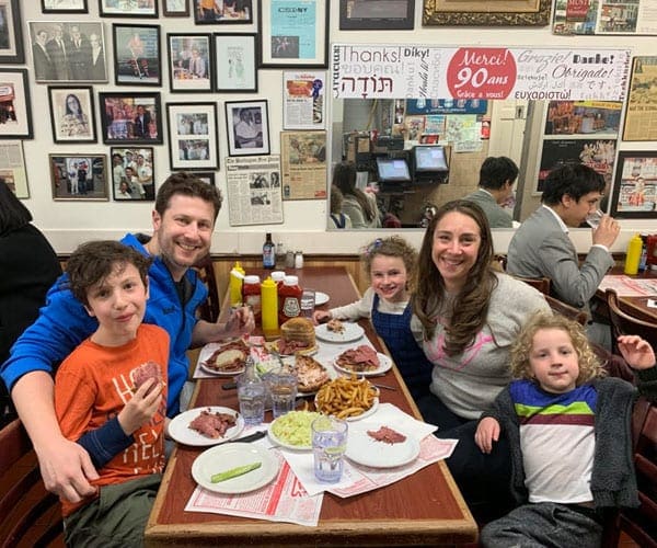 A family of five enjoys dinner at one of the best restaurants in Montreal with kids.