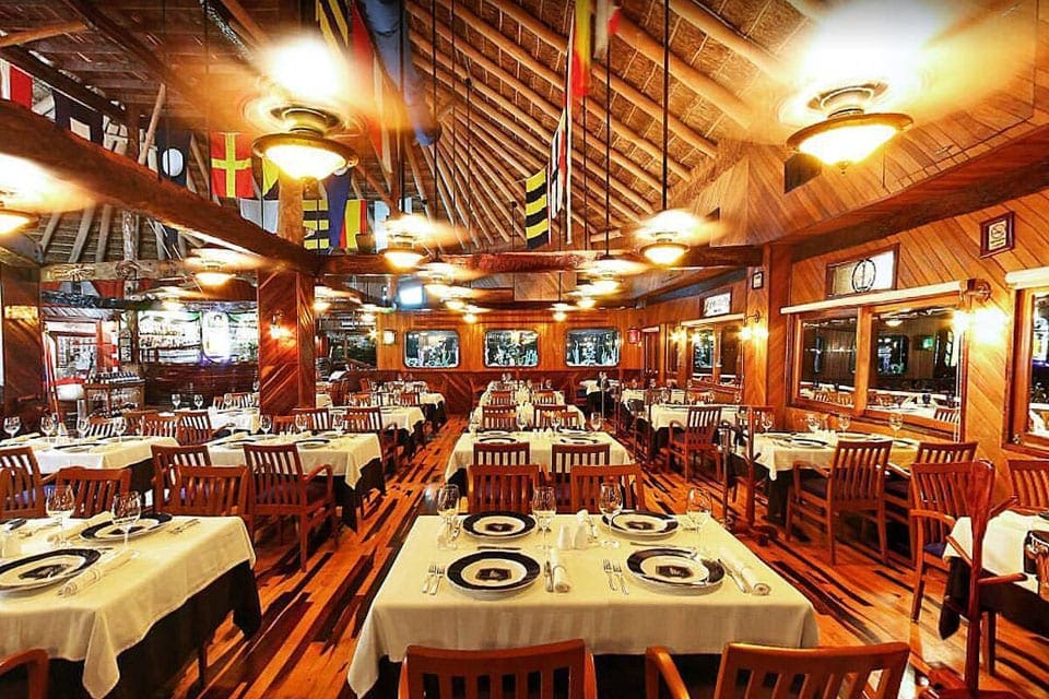 Inside Lorenzillo’s, featuring a crisp, clean dining room with fun, nautical features.