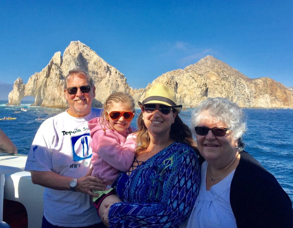 Family in a boat in Los Cabos