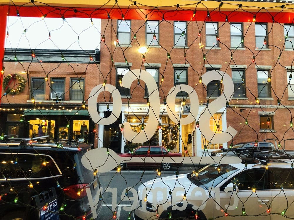 Street view from window with lights on window in Great Barrington, one of the Best Cute Towns To Visit With Kids Near NYC.