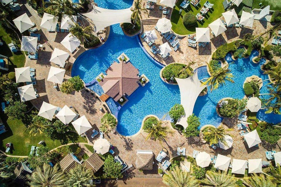 An aeiral view of the huge pool and surrounding cabanas at the Jumeirah Beach Hotel.