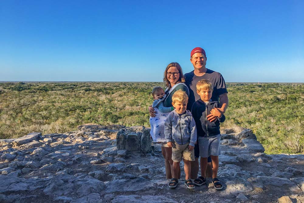 Family posing in Nohoch Mul Playda del Carmen, an ideal stop while in Cancun with kids.