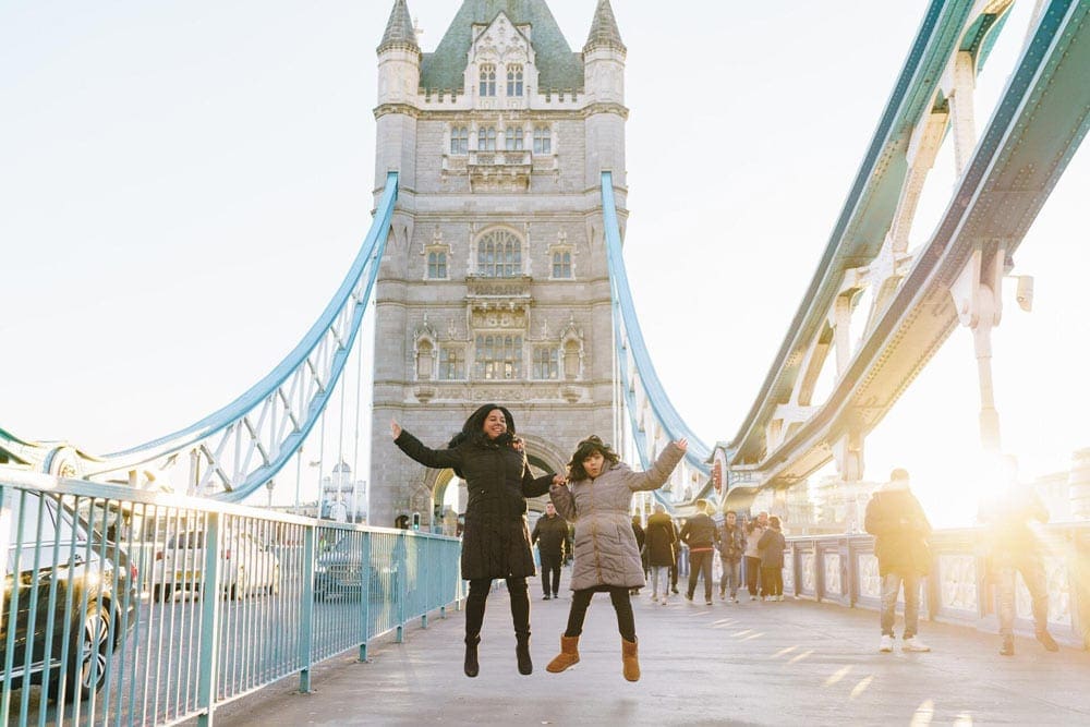 Mom and daughter jumping on London Bridge 