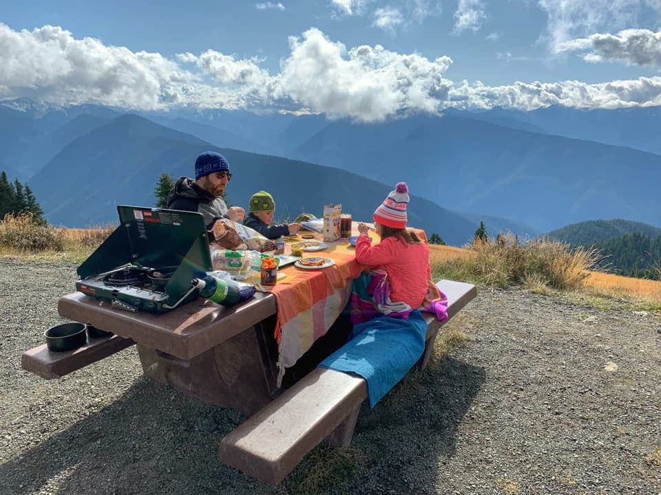 Family enjoying meals with a beautiful view