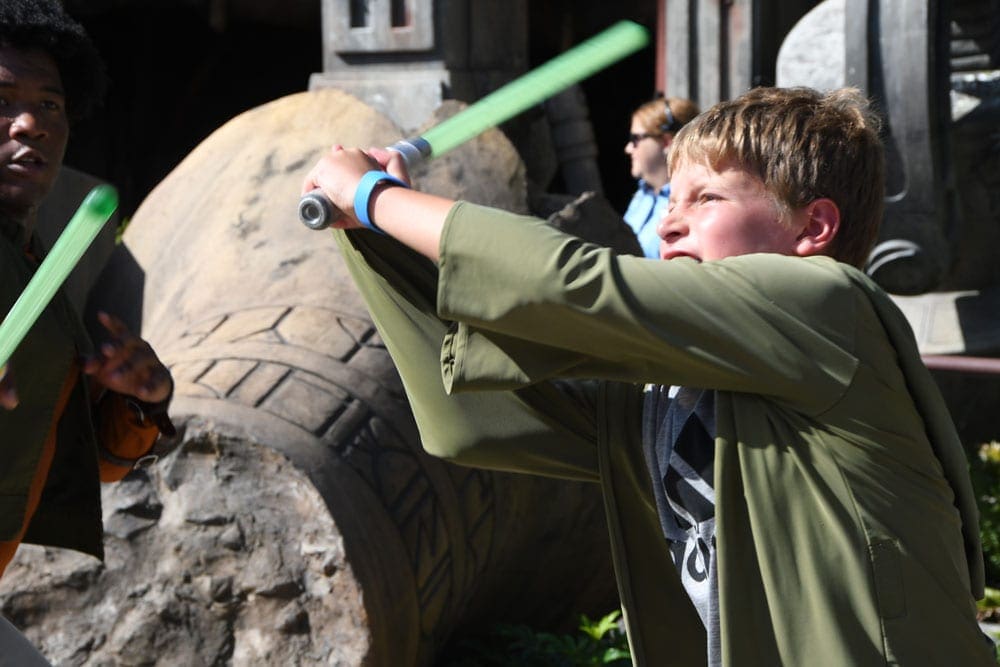 Boy in Star Wars activity at Disney World, one of the top father-son weekend ideas.