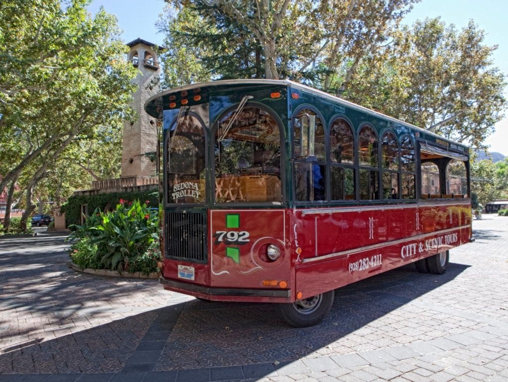 An iconic Sedona Trolley sits proudly in downtown Sedona.
