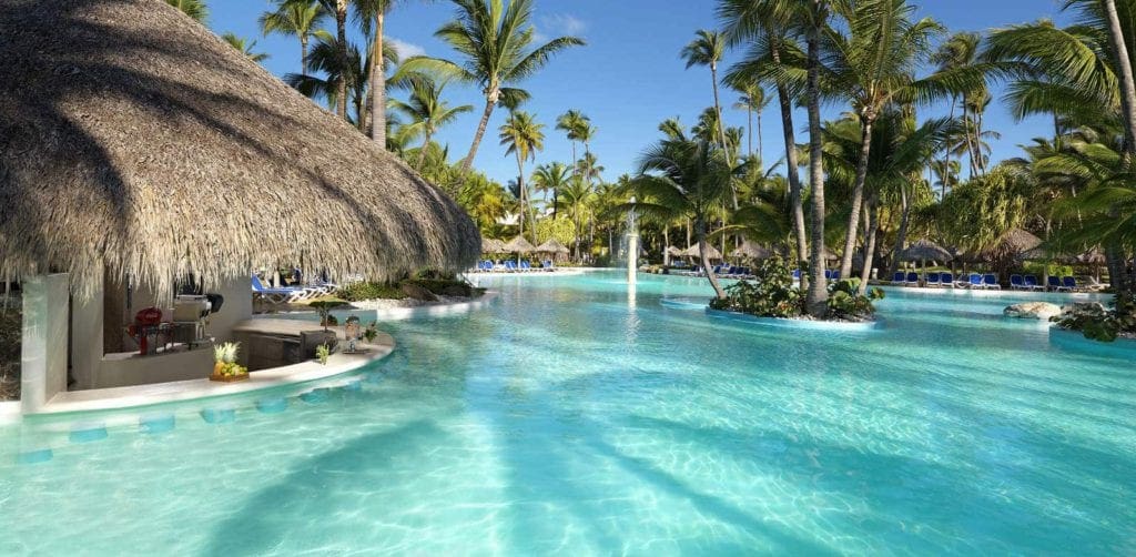 A gorgeous view of the pool and cabana at Meliá Caribe Beach Resort, one of the best Caribbean resorts with baby clubs.