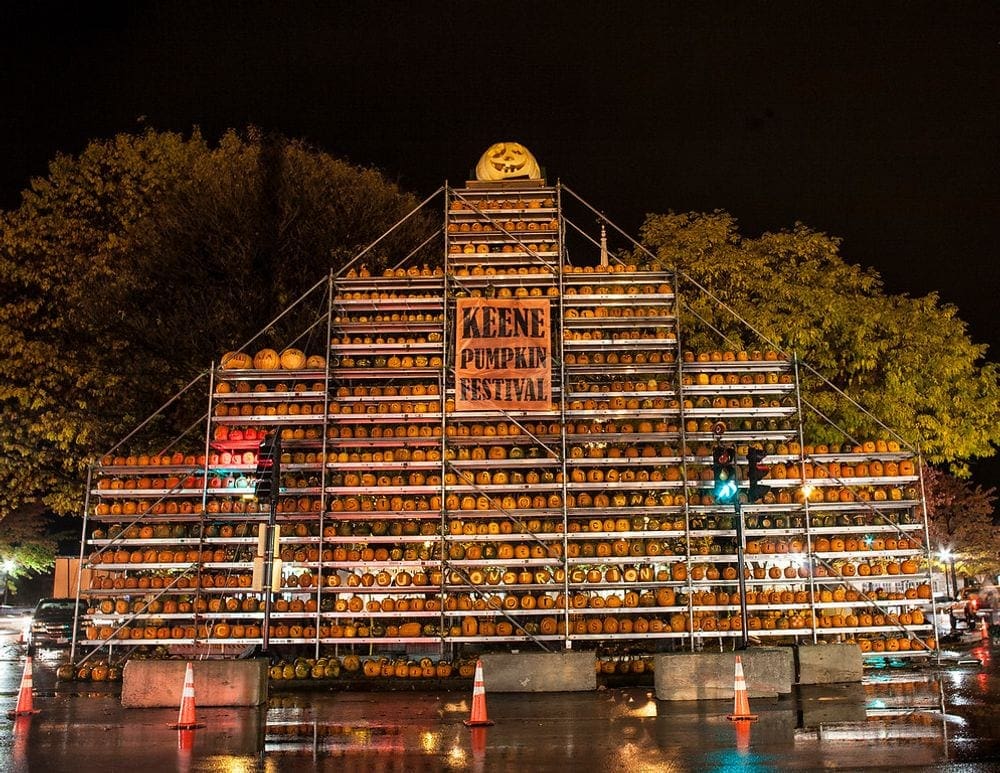 A hudge pumpkin display, featuring hundreds of carved pumpkins, as part of the Keene Pumpkin Festival in New Hampshire.