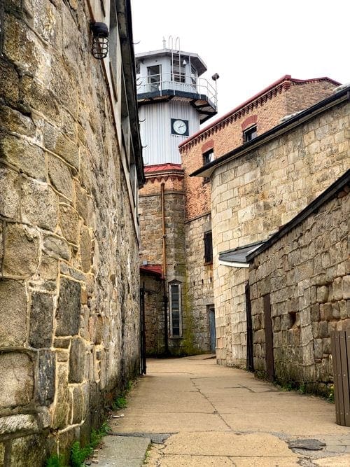 Outside the Terror Behind the Walls Easter State Penitentiary in Philadelphia, down a long outdoor coridor leading to the watch tower.