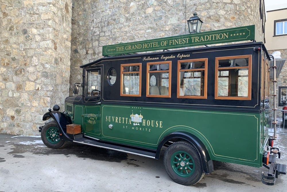 The green Suvretta House trolley sits partked outside.