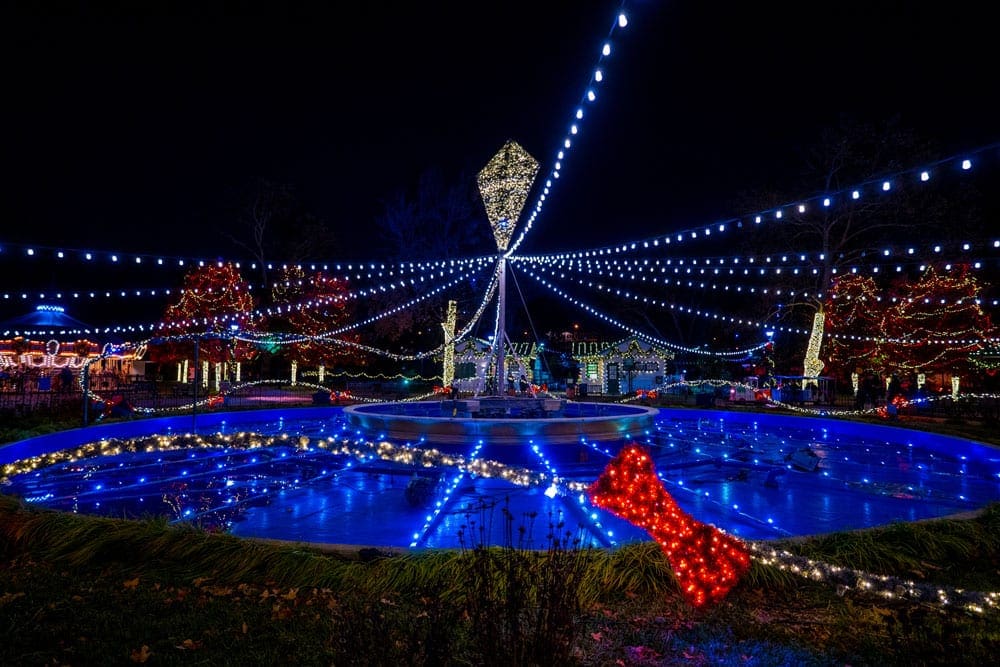 Franklin Square lit up with colorful Chirstmas lights during the Sparked by Benjamin Franklin event, one of the best things to do in Philadelphia with kids this winter.