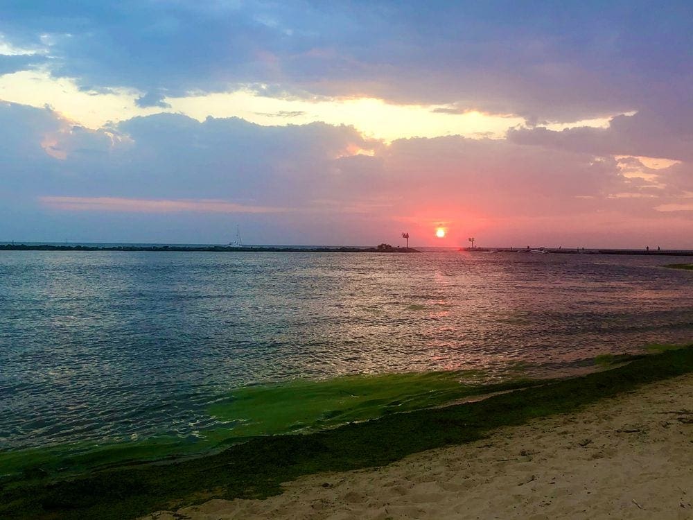 The sun sets over Lake Michigan.