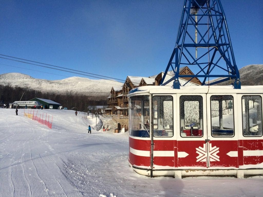 A red and white gondola rests on the grounds of Jay Peak in Vermont.