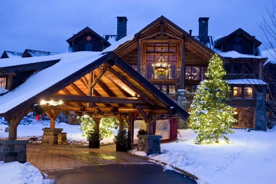 A wintery view of Whiteface Lodge at night.