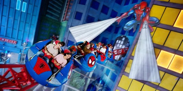 Several people enjoy a Spiderman-themed ride at IMG World of Adventure.