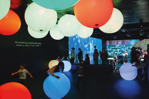 Kids play in one of the interactive rooms with light up balls at OliOli Experimental Centre.