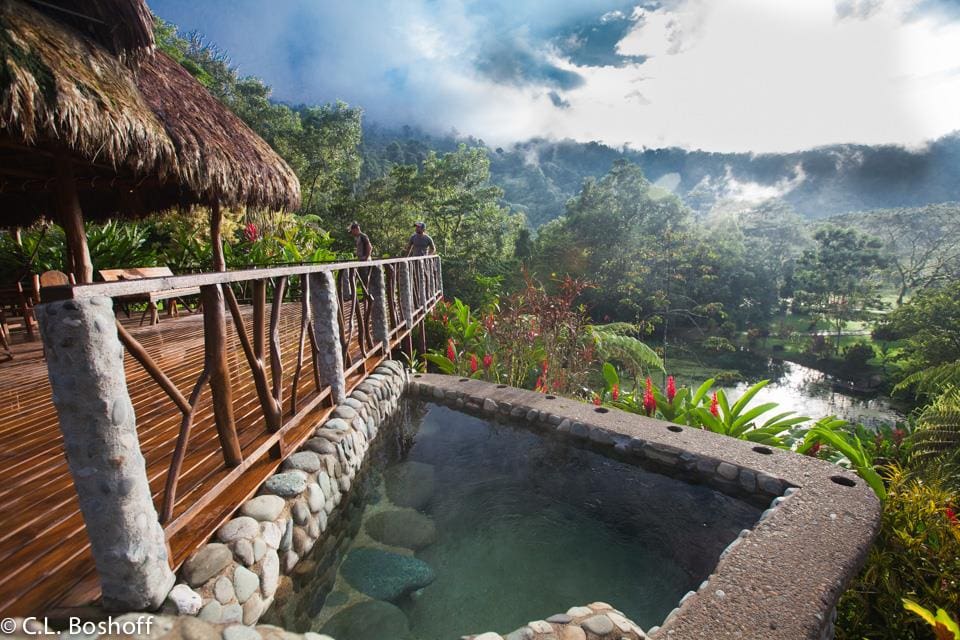 A balcony overlooking the pool and jungle views at Rafiki Safari Lodge, one of the best Costa Rica resorts for a family vacation.