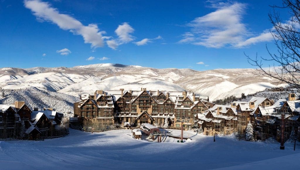 The resort grounds and buildings on a sunny day at the Ritz-Carlton, Bachelor Gulch, one of the best ski-in/ski-out resorts in the U.S. for families.