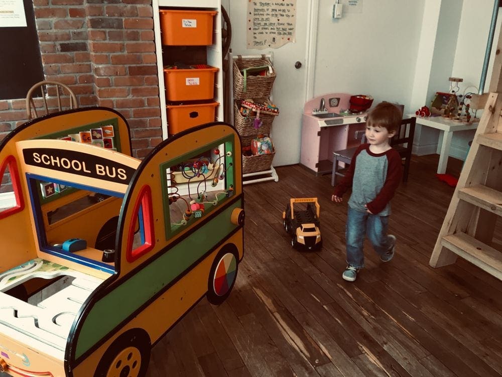 A young boy plays inside a museum in Montreal, one of the best things to do during your three-day Montreal itinerary with kids.