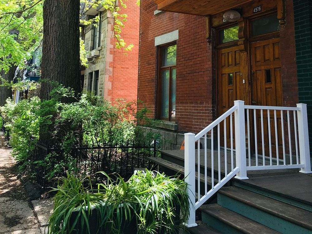 A beautiful brick home on a sunny day in Montreal.