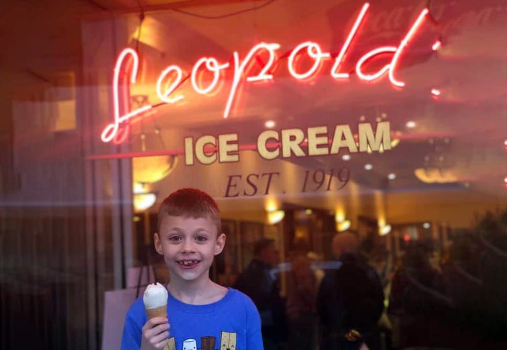 A young boy grins with his ice cream cone outside the inconic Leopold’s Ice Cream in Savannah.