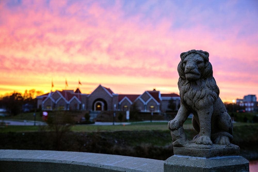 A view of a museum, wiht a large lion statue in Cedar Rapids, Iowa.