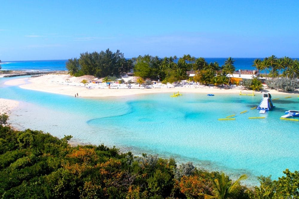 Beautiful blue lagoon with inflatable play structures in the Bahamas.