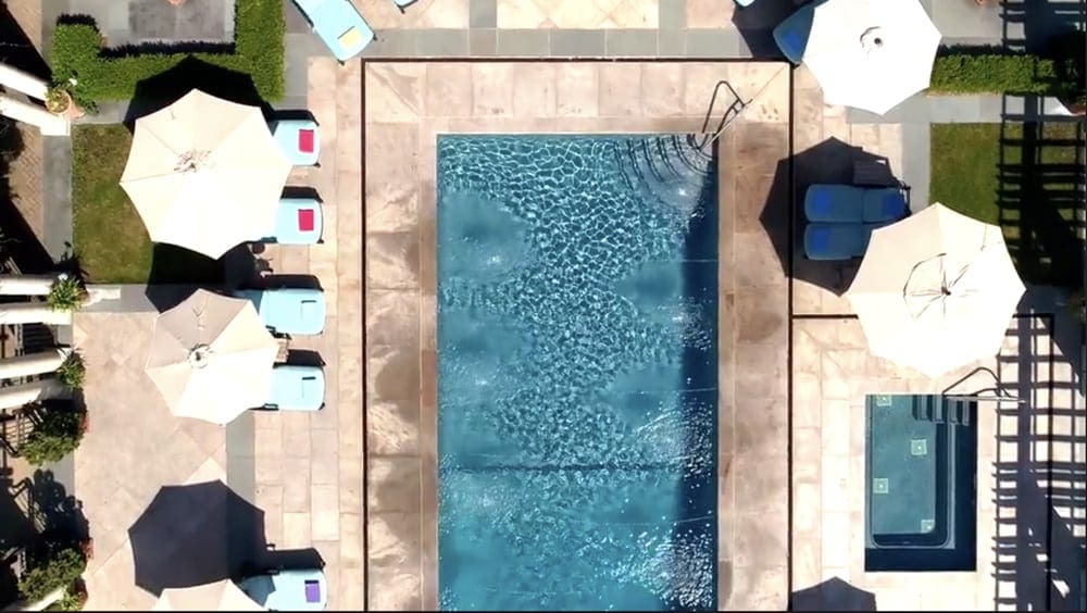 An aerial view of the pool and pool chairs at Glenmere Mansion, one of the best mom's weekend getaway locations.