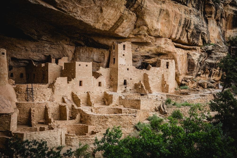 A stunning view of the remaining indigenous buildings at Mesa Verde National Park, one of the best weekend getaways near Denver for families.