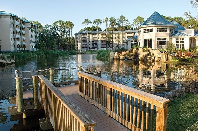 A boardwalk leads to the water with Marriott's SurfWatch in the distance, one of the best family hotels in Hilton Head.