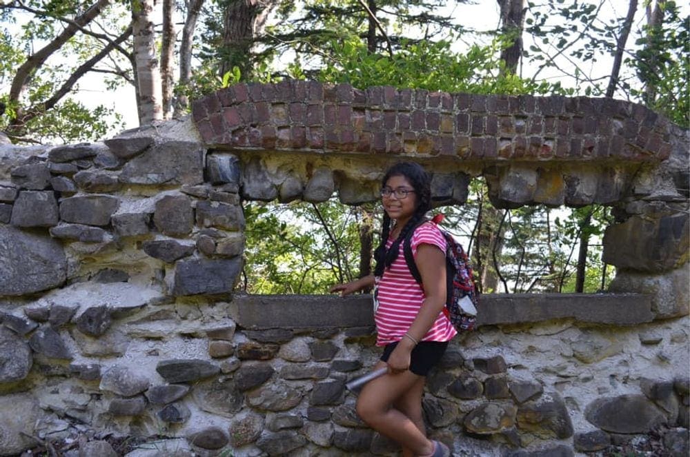 A young girl poses while exploring Bar Island.