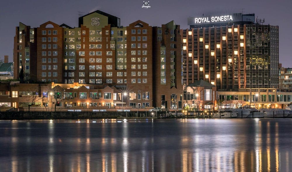 A view of the Royal Sonesta Boston with a heart shape created by lit windows along the front of the hotel.