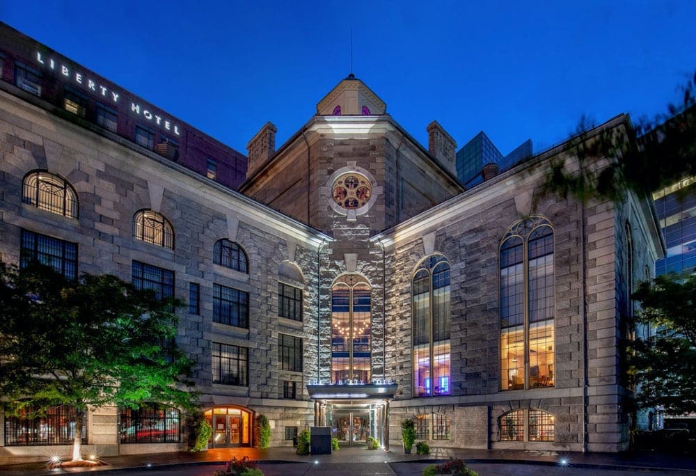 The stunning entrance to the The Liberty, a Luxury Collection Hotel, Boston at night, one of the best hotels in boston for families.