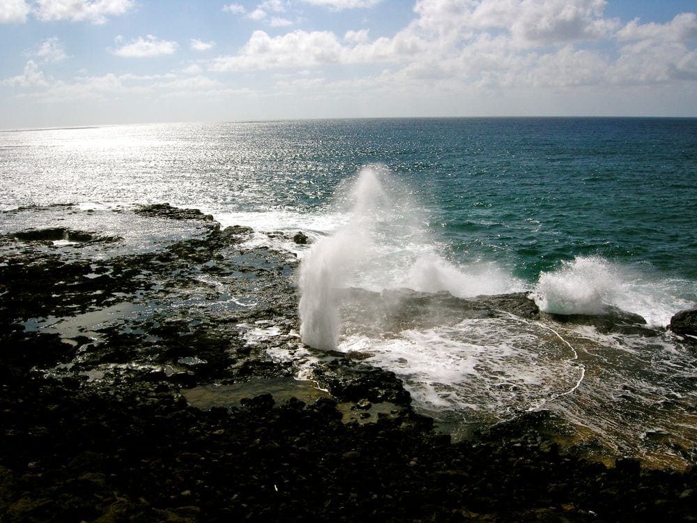 Water spirts up from the Sprouting Horn Park in Kauai.